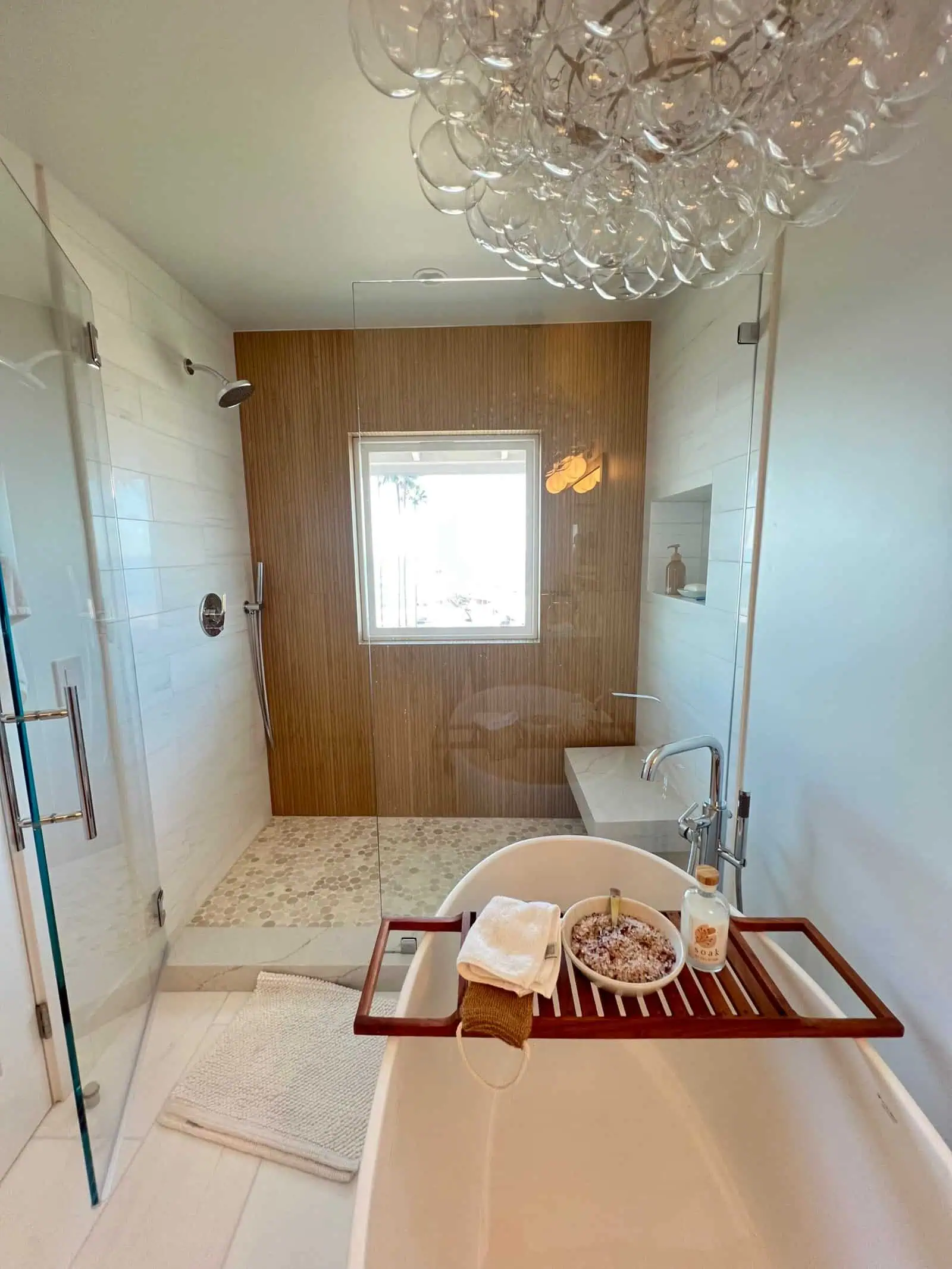 Modern bathroom with stylish tile work and a relaxing bathtub area.